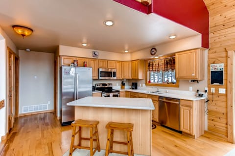 There is seating at the kitchen island and plenty of counter space to prepare your meals.