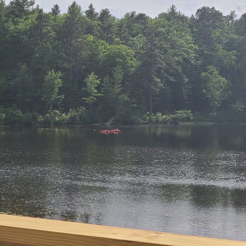 view from deck of Kayaks fishing on pond