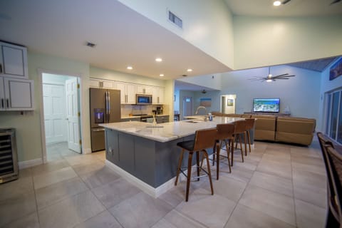 Kitchen island with extra sitting area on the other side.