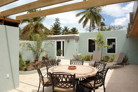 Private patio garden with outside dining area 