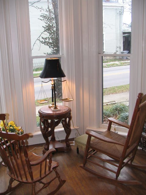 Ten foot high bay windows make a nice indoor settee.
