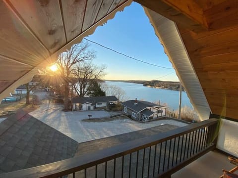 2nd Level coverd porch with sunset views over the other cabins in the village