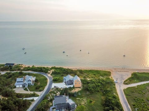 drone view of property's proximity to bay in the distance
