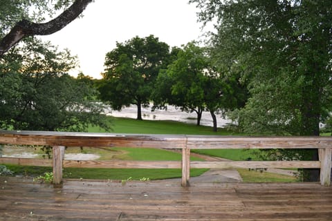 View off deck overlooking golf course and creek
