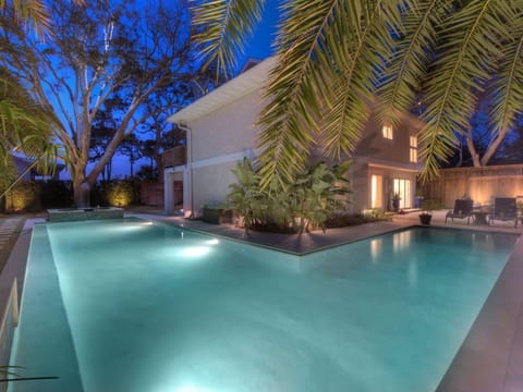 Twilight view of expansive private pool