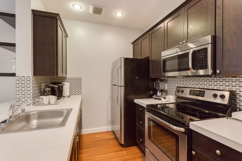 All new stainless steel appliances and kitchen cabinets.