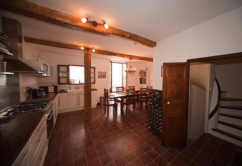 Kitchen and dining area; with doors to patio. Original 19th century doors.