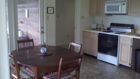 Kitchen, with view of the screen porch