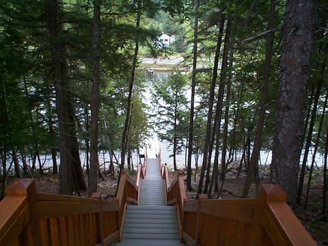 Steps leading down to private dock on Moose River leading to Moosehead Lake