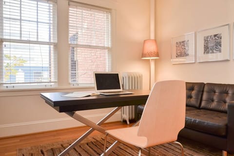 The coffee table raises to seating height, creating a great place for email...