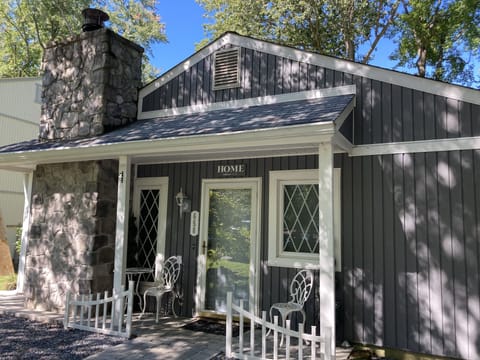 Inviting cottage beside wooded lot for privacy.