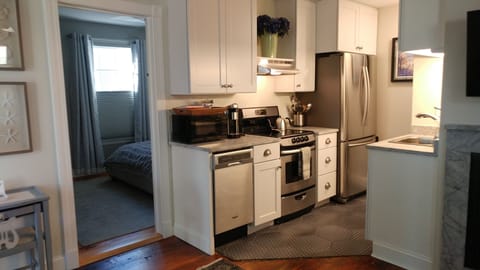 microwave, dishwasher, stove, fridge, utensils, pots and pans