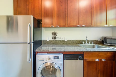 A combined washer/dryer, dishwasher and fridge round out the amenities.