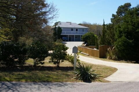 Situated on beautiful 1 acre lot backing to 5 acres of Marine forest and canal