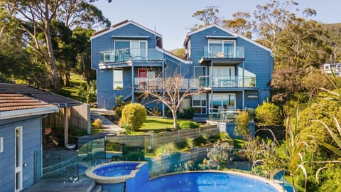 Breathtaking is the view of our house exterior, complete with a sparkling pool and inviting spa. Here, charm and elegance converge amidst picturesque surroundings.