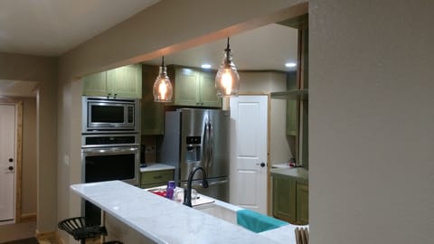 Gourmet kitchen with all new appliances and custom cabinets