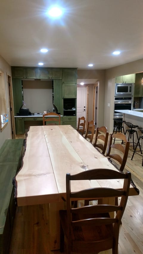 Custom made pine log dining table that can seat 14 people