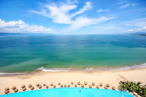 Looking off your balcony over the pool at the bay!