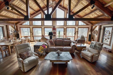 The great room with huge stone fireplace and mountain views.