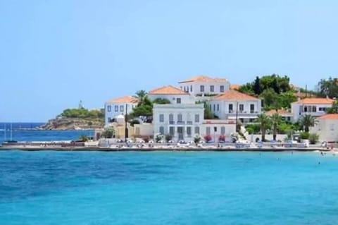 AERIAL VIEW OF THE HOUSE IN AGIOS MAMAS – IT IS FOR THE HOUSE WITH CERAMIDES AND