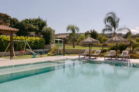 A tranquil poolside escape with dedicated children’s compartment for safe play.