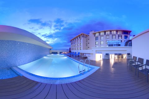 Outdoor pool, open 7:00 AM to 7:00 PM, pool umbrellas, sun loungers