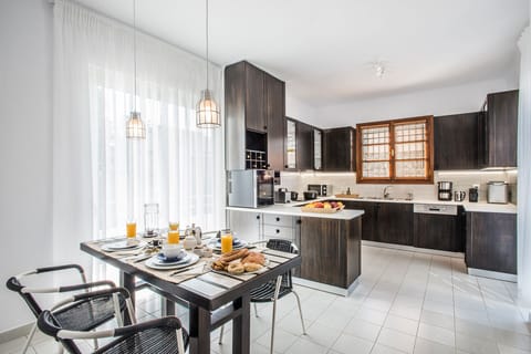 Kitchen on the first floor with a balcony and direct access to the swimming pool