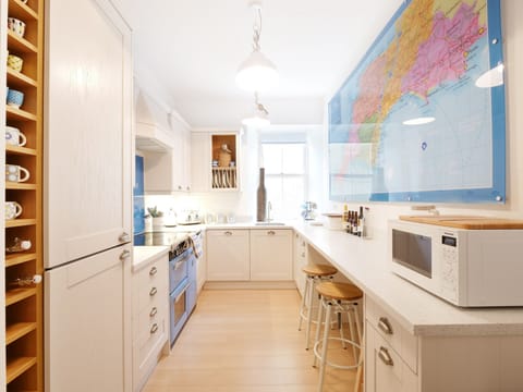 The fab kitchen with breakfast bar to chat at whilst cooking or plan a Getaway!