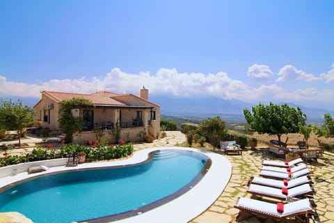 The pool terrace is equipped with sun beds and surrounded by flowers!