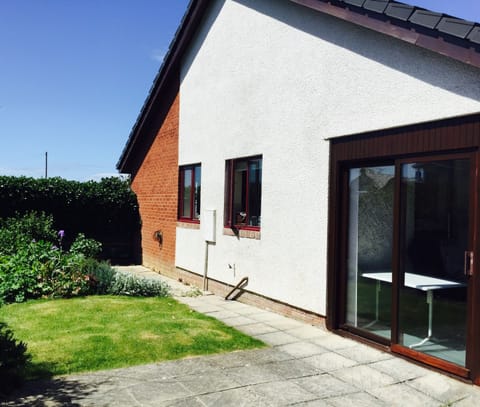 The secluded rear garden and patio area