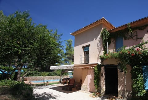 Side of house with pool in background