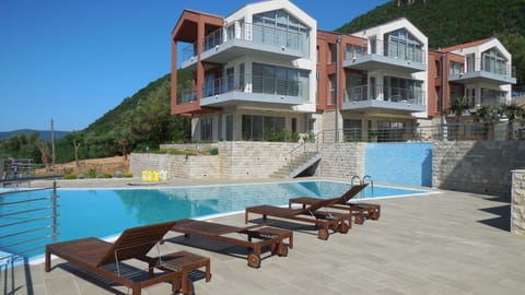 Over the pool, view of the apartment (first building,2nd floor) and the terrace.