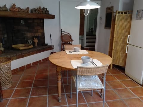 The spacious kitchen, and its fireplace.