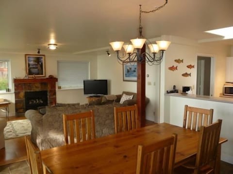 Living room & Dining room just steps from an endless sandy beach!