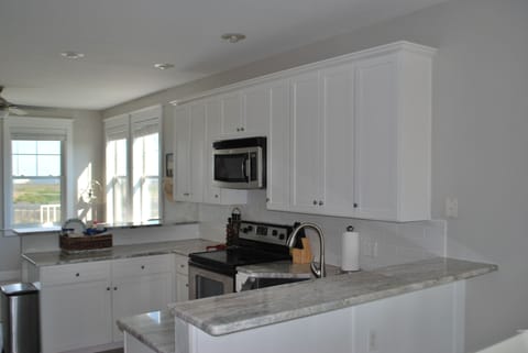 Newly renovated kitchen is bright and open to the living areas.