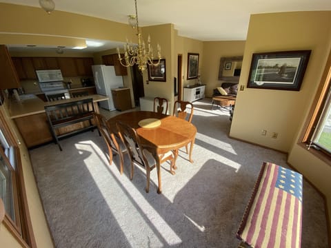 Dining room view into kitchen and living room.