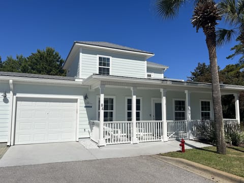 Large front porch, parking for 2 vehicles and a garage 