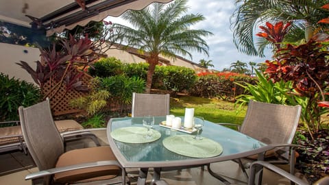 Quiet, garden view on our lanai.  Retractable umbrella to shield you from sun.