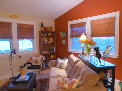 Living room has cathedral ceiling and a queen size sleeper sofa