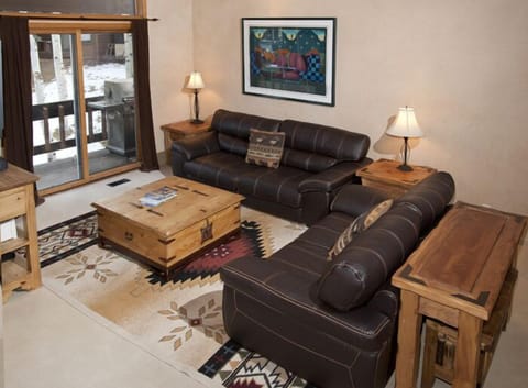 Spacious 2 Story LR, brand new leather couches, flat screen TV, FP, and access t