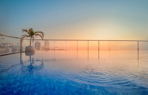 Outdoor pool, open 6:00 AM to 6:00 PM, pool umbrellas, sun loungers