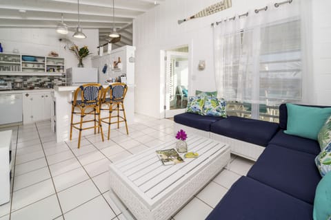 Contemporary open floor plan with cottage beach   decor touches.