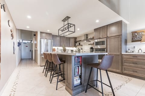 Stunning renovated kitchen with family gathering island.