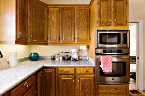 Kitchen with granite countertop, island, stainless steel appliances