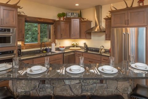 Granite counter tops and stainless steel appliances upgrade this amazing kitchen