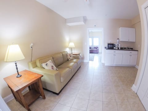 sitting room between the garage and 1st bedroom. 