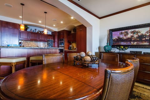Kitchen and dining room with seating for nine guests.