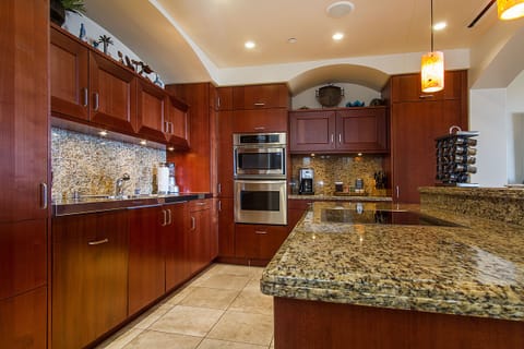 Kitchen with two Sub Zero refrigerators, microwave, Viking stove, & dishwasher