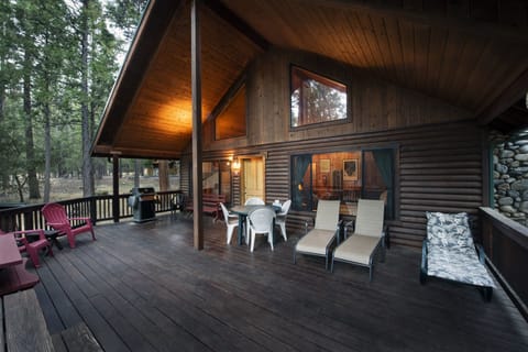 Front of cabin and its relaxing wood covered deck for all year-round BBQ experience.