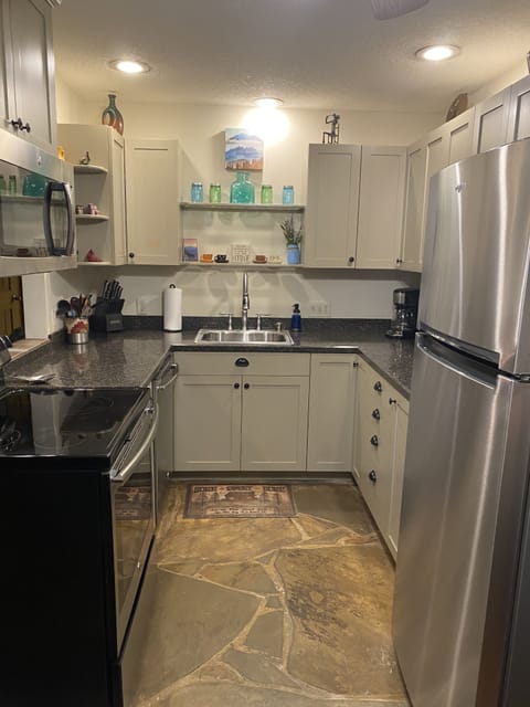 Kitchen with stainless steel appliances. 